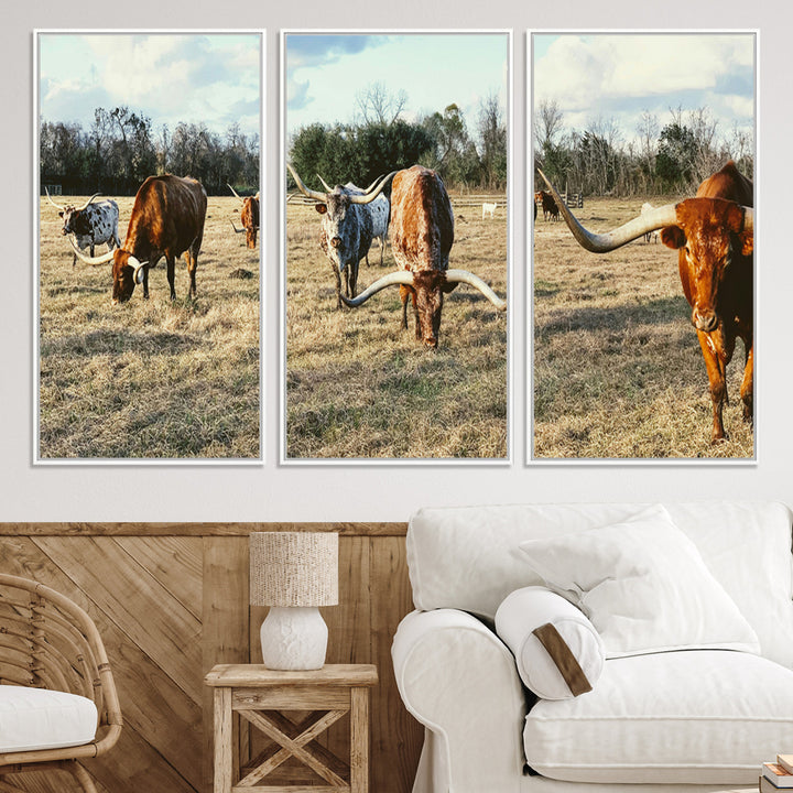 A herd of Texas Longhorn cattle grazing in an open field under a partly cloudy sky, capturing a rustic and Western ranch aesthetic.