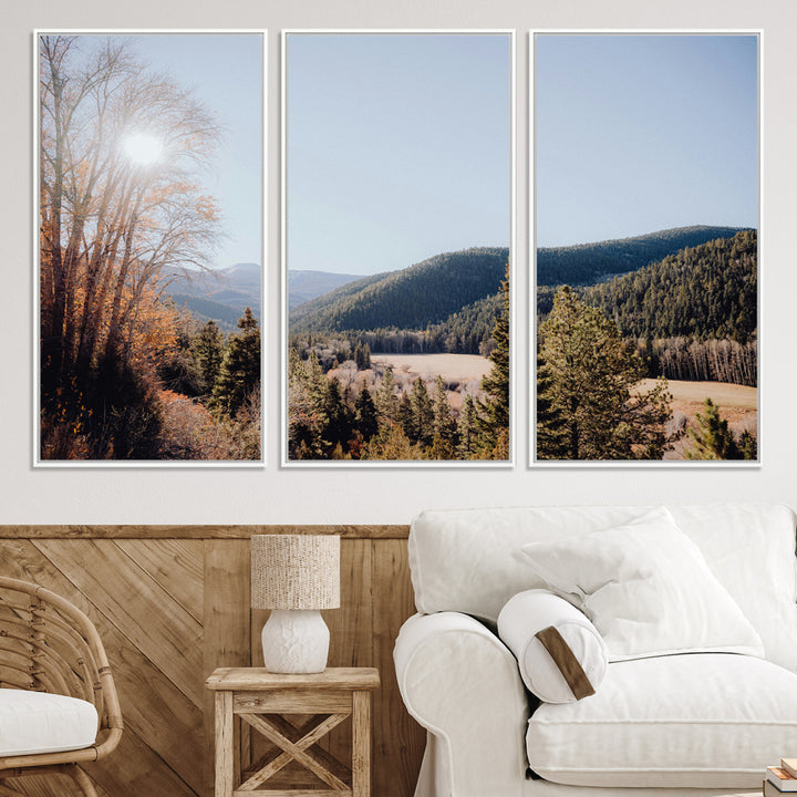 A scenic mountain valley with pine trees and autumn foliage under a clear sky, bathed in golden sunlight, creating a peaceful and rustic landscape.