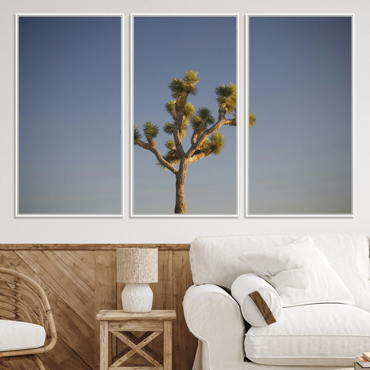 A lone Joshua Tree standing against a deep blue sky, capturing the serene and rugged beauty of the Southwestern desert landscape.