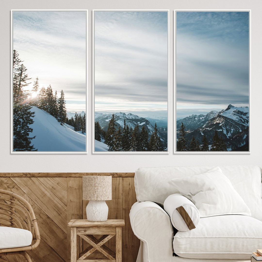 A breathtaking view of snow-covered mountains with evergreen trees and soft sunlight peeking through, creating a serene and peaceful winter scene.