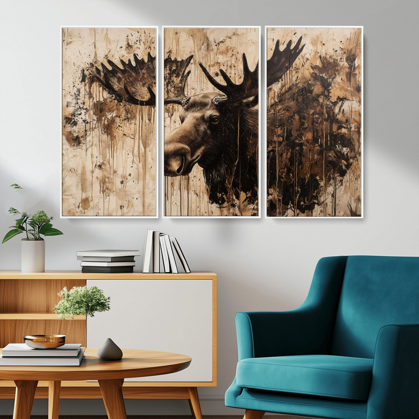 Artistic painting of a moose head with large antlers in shades of brown and black, with paint splatters and drips on a beige textured background, creating a rustic and expressive wall art canvas.