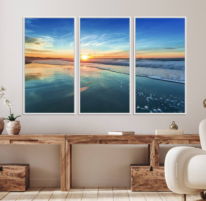 The Blue Sky and Beach Wall Art Canvas Print features a vibrant orange sky reflecting on wet sand.