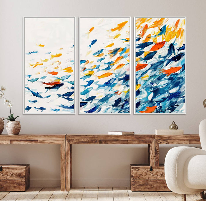 A colorful Abstract Fish Shoal Canvas Print hangs on the wall.