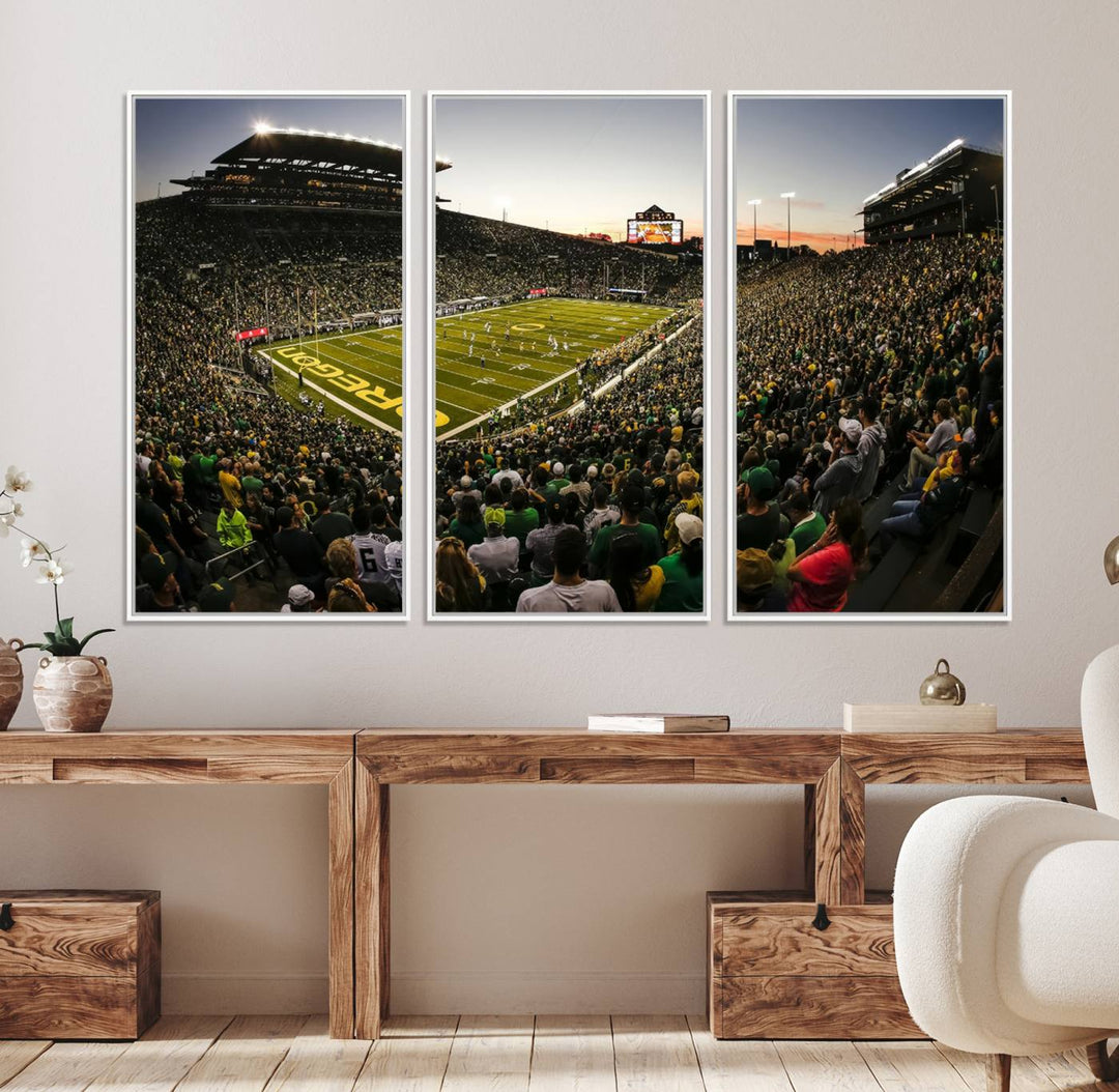 The Oregon Stadium Canvas Wall Art features a depiction of a packed Autzen Stadium with OREGON prominently displayed on the field.