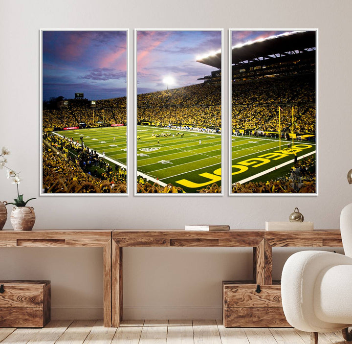 This gallery-quality canvas print features a depiction of the OREGON field filled with fans at sunset, capturing the essence of the University of Oregon Ducks Autzen Stadium.