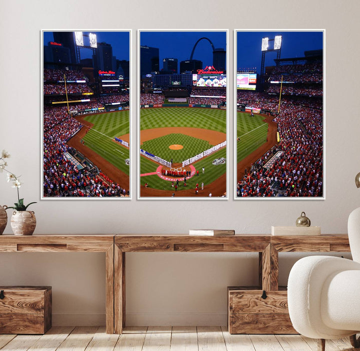 A Cardinals wall art canvas print depicts Busch Stadium with players lined up on the field and a full audience under the lights, capturing the vibrant atmosphere.