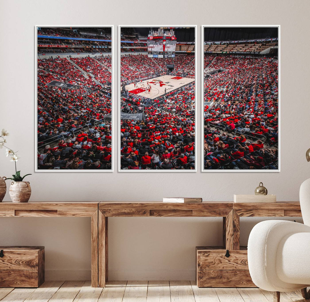 A painting of Louisville Cardinals fans in red at the KFC Yum Center Arena.