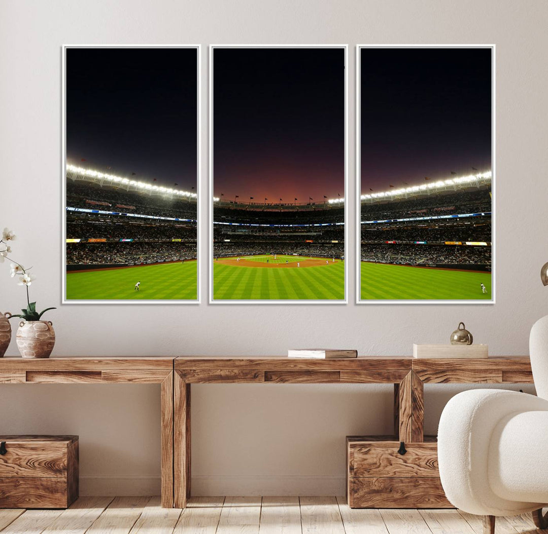 A night game at Yankee Stadium depicted on canvas beneath a sunset sky.