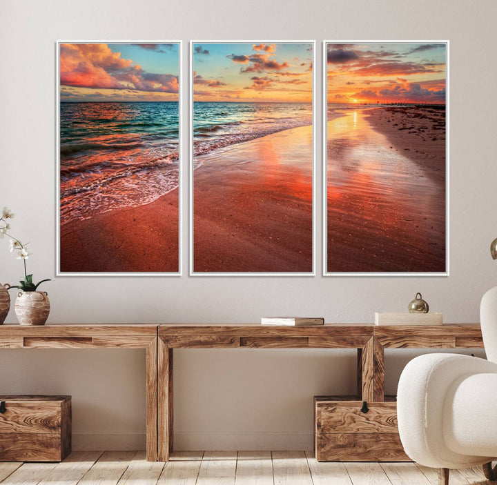 An Ocean Canvas Print depicts a sunset over a beach with reflections.