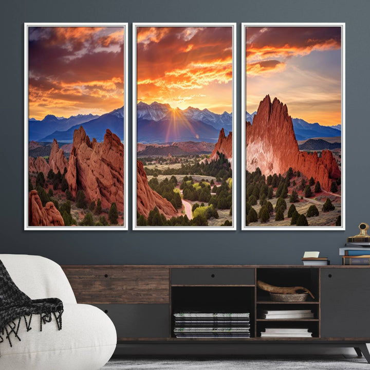 A vibrant sunset over the Rocky Mountains with red rocks.