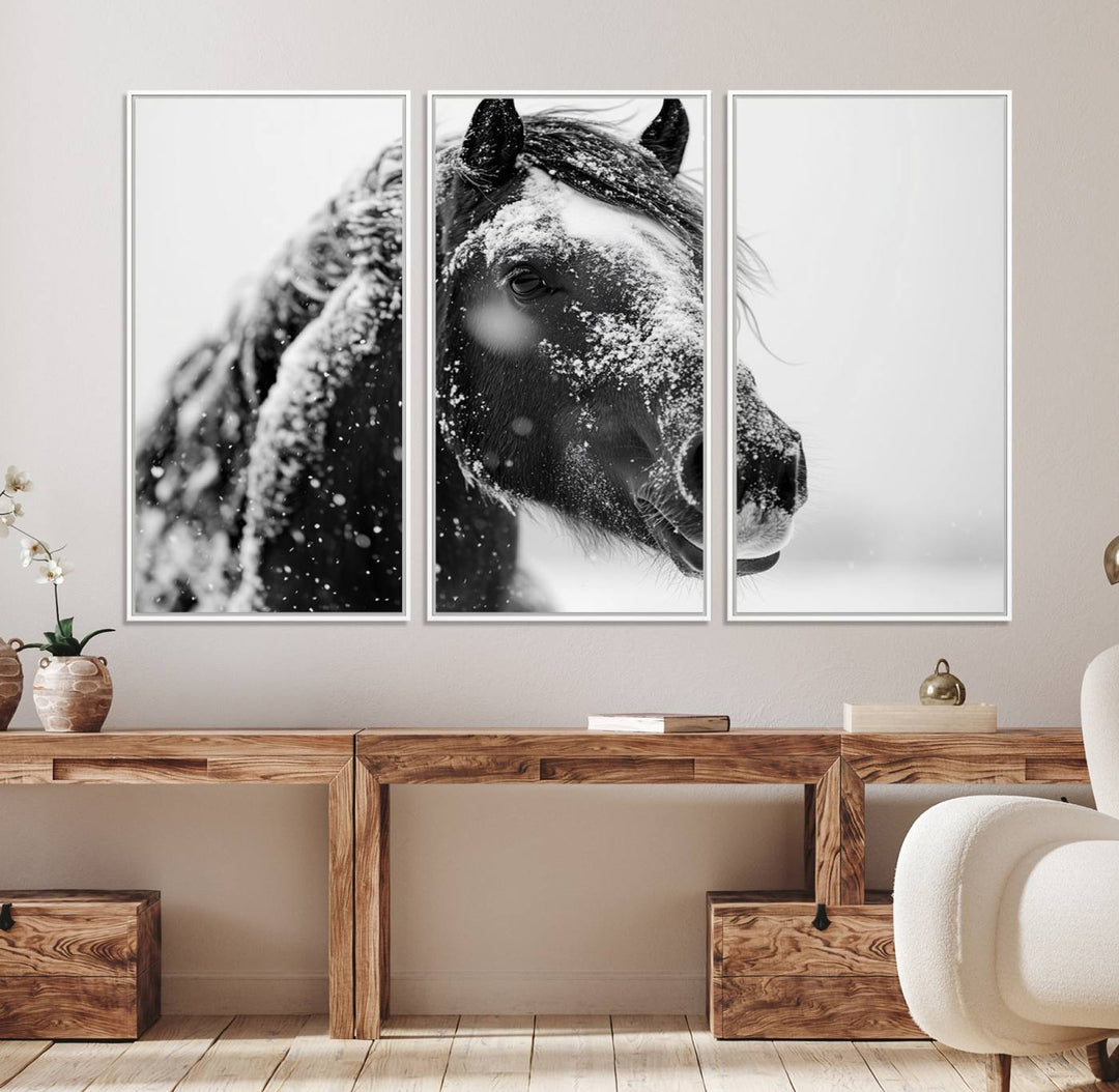 A large 3-panel rustic farmhouse wall art showcases a black and white winter horse canvas print against a snowy backdrop.