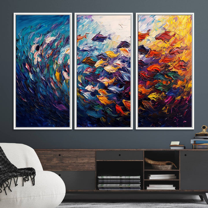 The Vibrant Abstract Fish Swarm Art features a colorful 3-piece canvas that adds a pop of color.