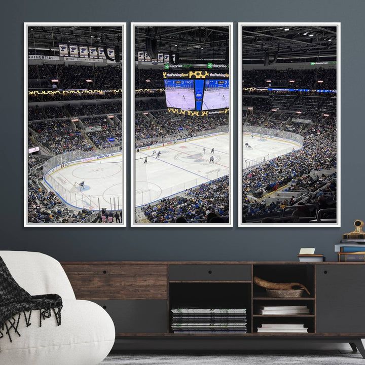 A large Enterprise Center canvas of a crowded hockey arena hangs prominently.