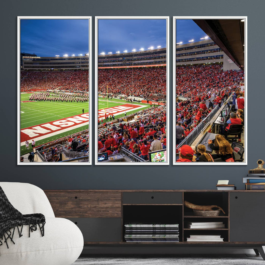 A vibrant wall art captures the essence of Madison Camp Randall Stadium, depicting a sea of fans in red and white during a Wisconsin Badgers football game under bright lights.