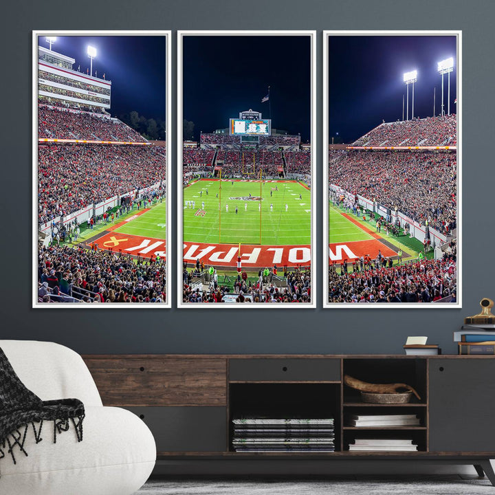 The wall art titled Wolfpack Football Team Print features Raleigh Carter-Finley Stadium at night, reproduced on premium canvas.