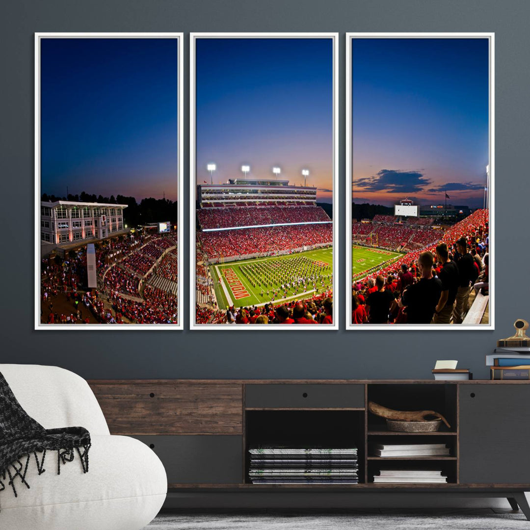 The Wolfpack Football Team Print captures a band and crowd at dusk in a premium canvas art style at Raleigh Carter-Finley Stadium.