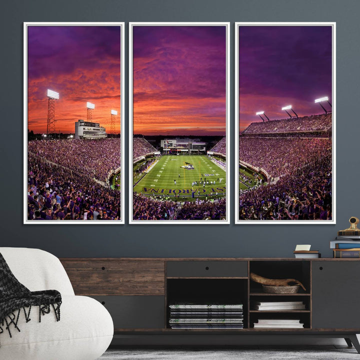 A sunset over Dowdy-Ficklen Stadium, Greenville, captured on museum quality canvas with vibrant purple and orange skies.