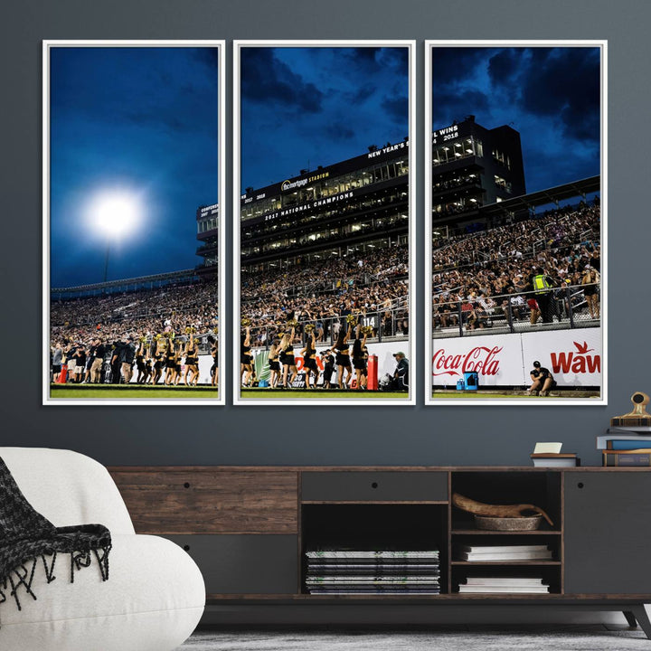 A gallery-quality canvas print depicting a stadium packed with fans under a night sky, highlighting the UCF Knights Football Team.