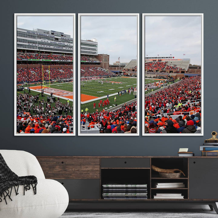 A University of Illinois Fighting Illini wall art canvas hangs on the wall, depicting a packed stadium.