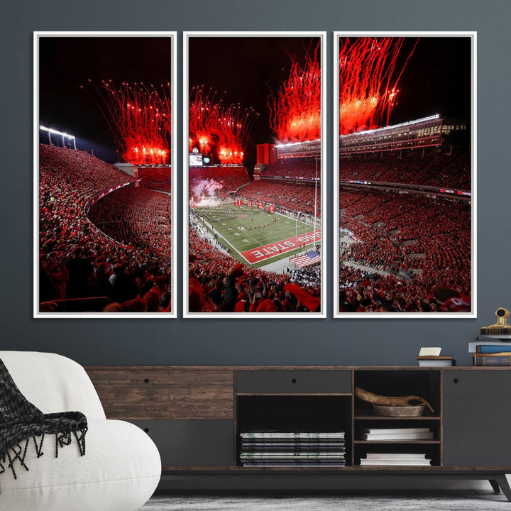 A vibrant red canvas art of a packed Ohio State Buckeyes stadium at night with fireworks.