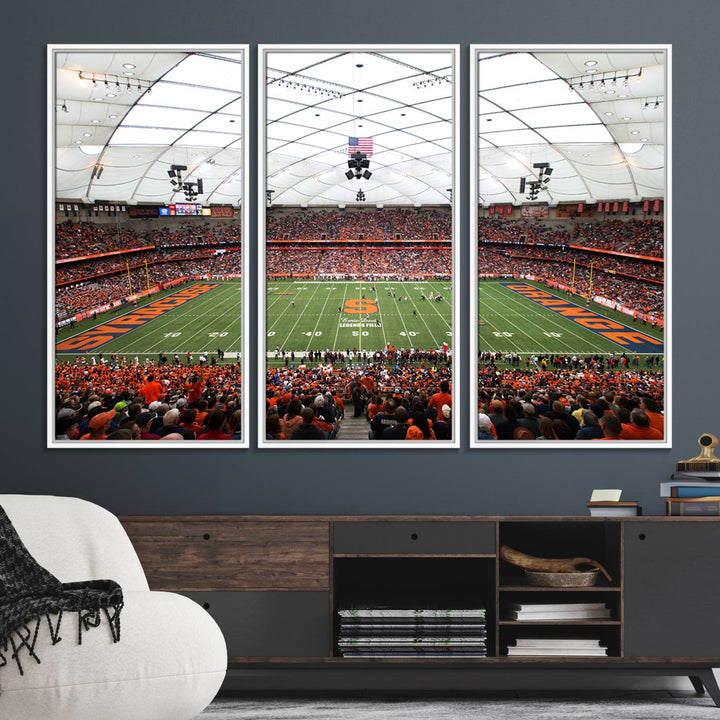 Fans fill the Syracuse JMA Wireless Dome, highlighted in orange and blue under a vaulted roof on this premium canvas print of the scene.