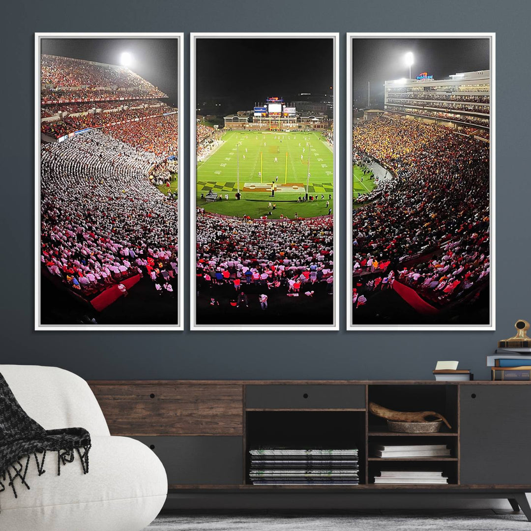 The Maryland Terrapins Football Wall Art Canvas showcases a packed SECU Stadium at night with a bright field and cheering fans.