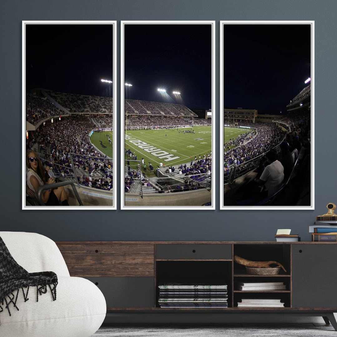 The wall art print features a night view of Amon G. Carter Stadium filled with TCU fans, showcased in the Horned Frogs Football Canvas Wall Art.