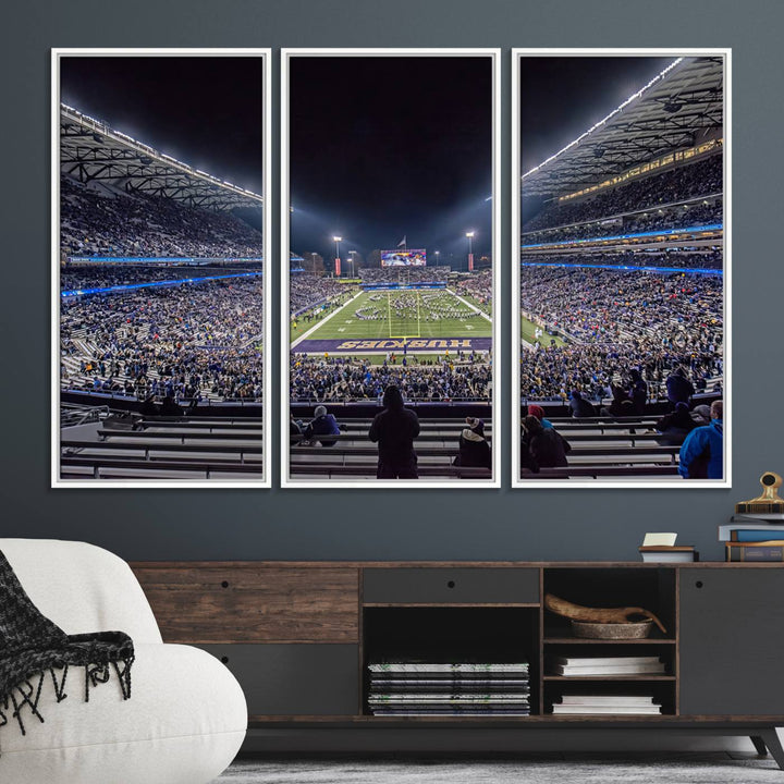 A canvas print titled The University of Washington Huskies Football depicts a packed Husky Stadium at night, as seen from the stands.