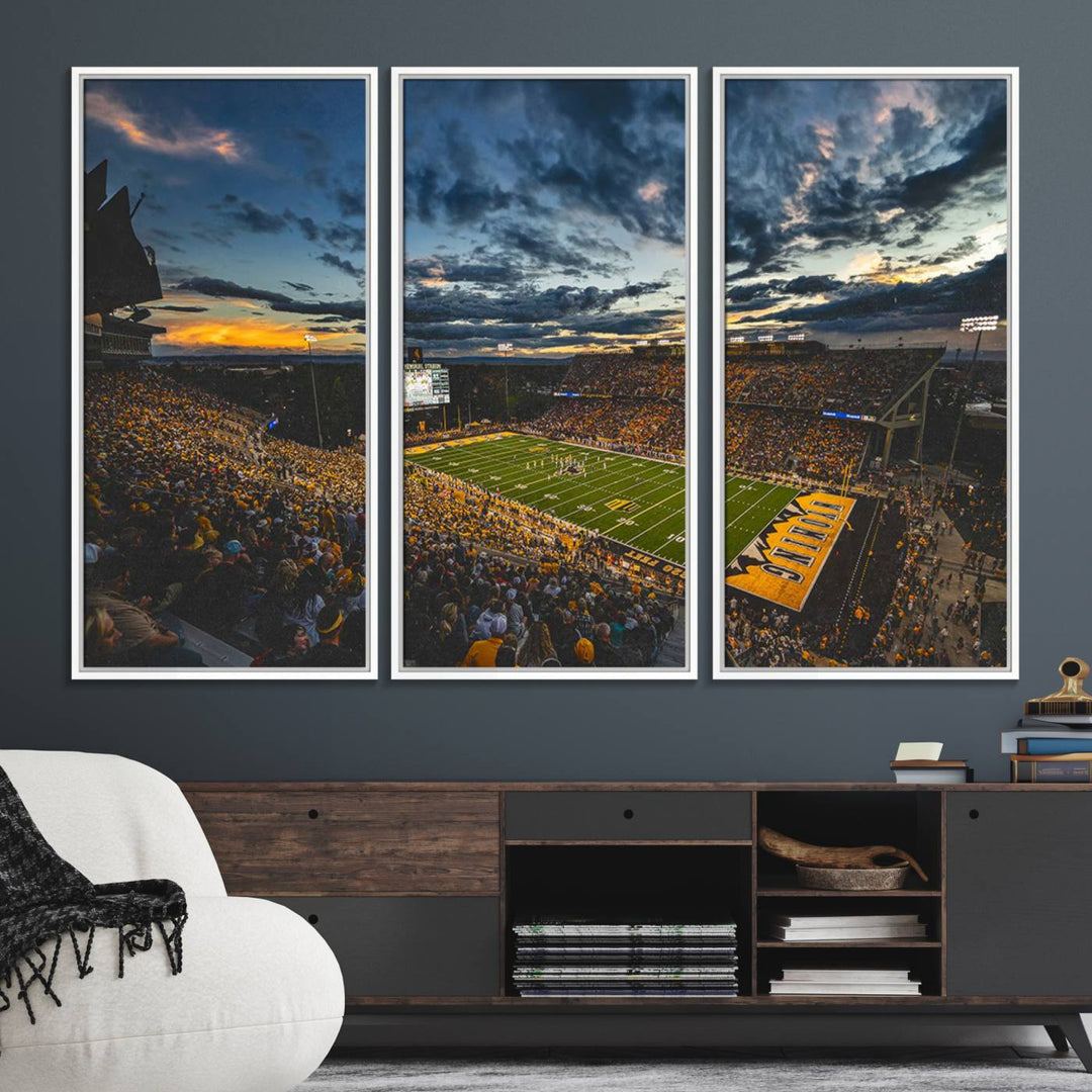 Laramies War Memorial Stadium Print captures a stunning scene of the stadium during sunset, set under a partly cloudy sky illuminated by bright lights.