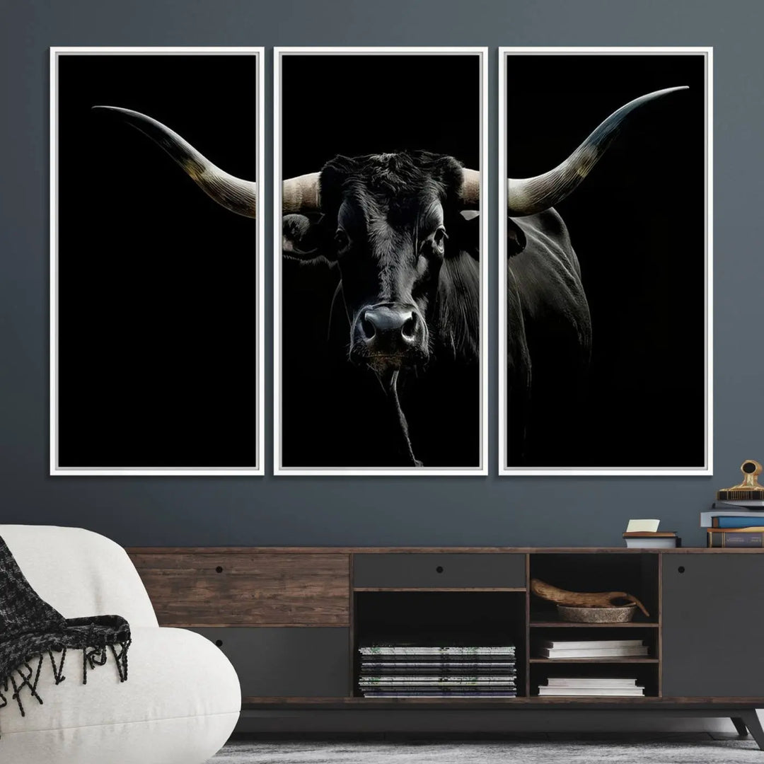 The Texas Black Longhorn Bull Canvas Print, featuring large curved horns set against a dark background, is ideal for Western decor.