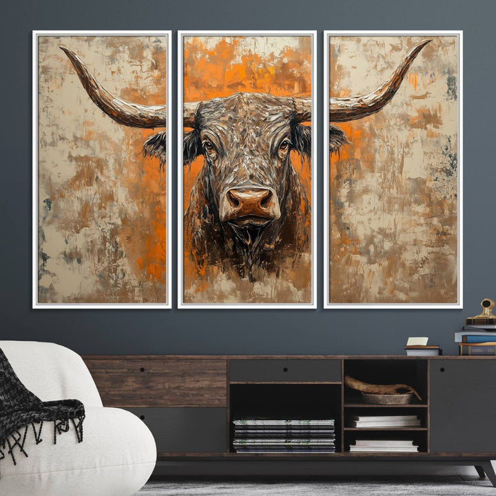 Abstract Cow Longhorn Bull Wall Art presents a detailed face centered on a textured orange and beige background.