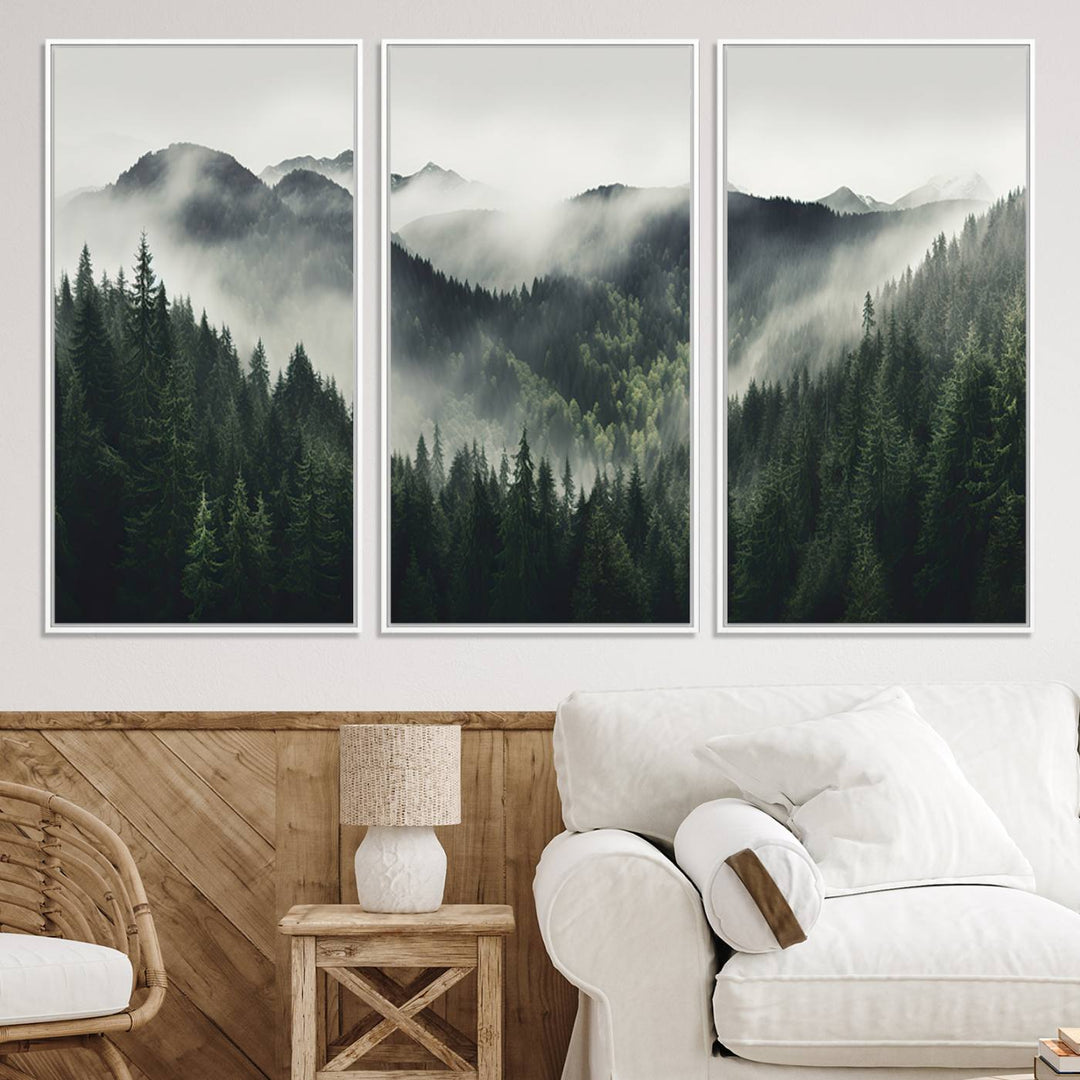 The Misty Forest Canvas Print Wall Art captures a serene misty forest scene with fog and mountains.