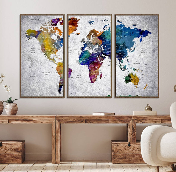 The World Map Art Canvas Print, featuring country names on a grunge-stained gray background, is perfect for stylish home decor.