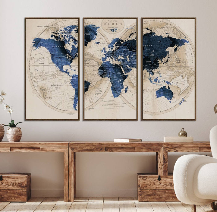 The Vintage Triptych Map Print is a grunge-stained blue and beige world map, perfect for enhancing wall decor.