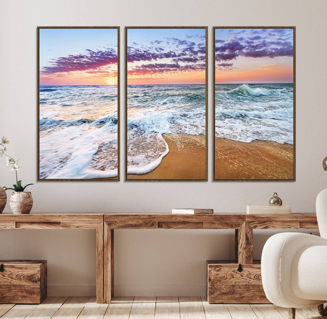 The Coastal Sunset Art Canvas Print features ocean waves beneath a vibrant sky in a stunning 3-panel seascape.