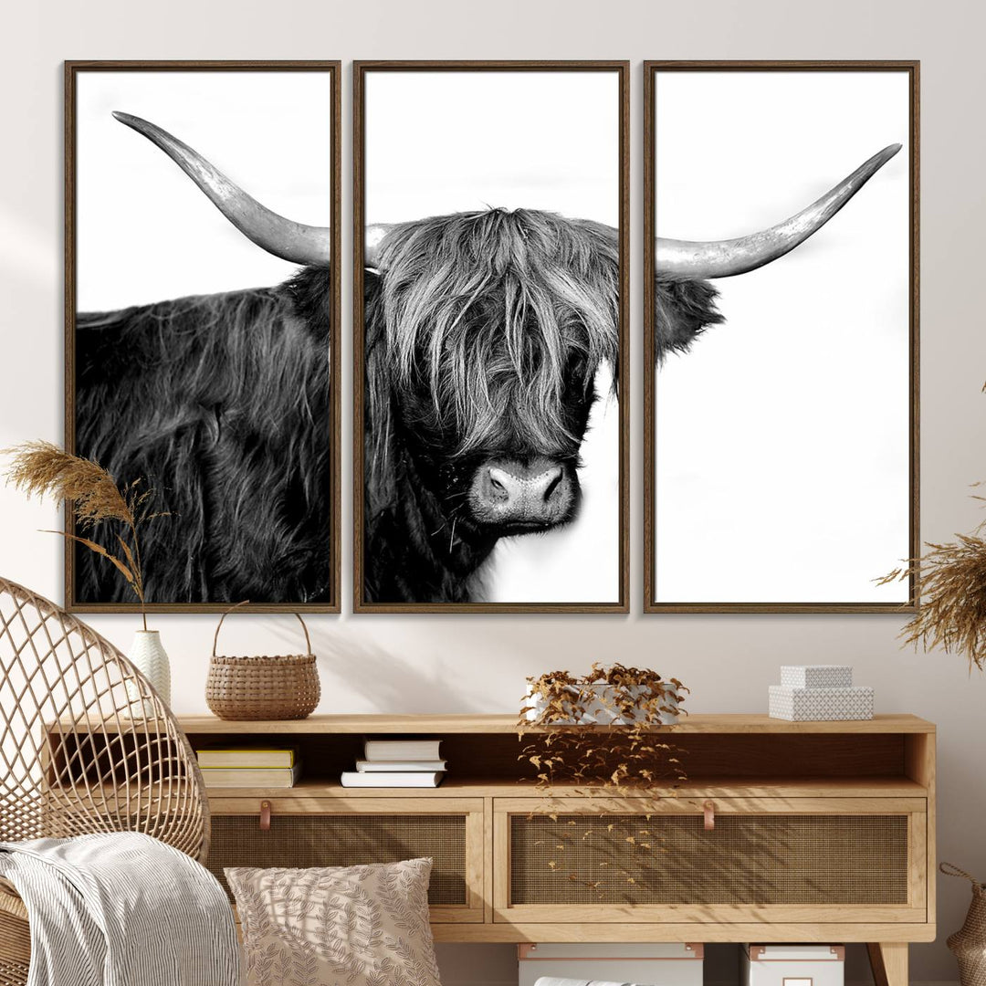 The Black and White Highland Cow Multi Panel Wall Art Canvas Print with UV-protection hangs prominently.