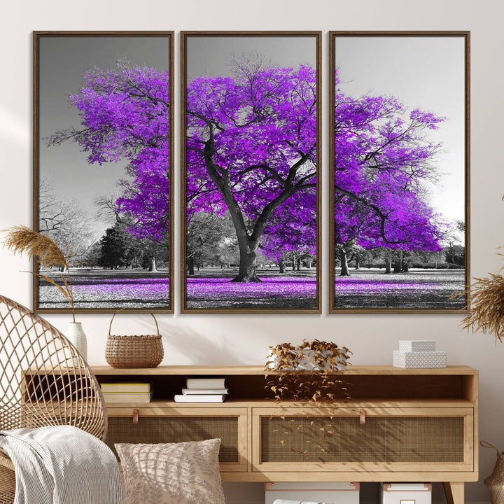 The Big Purple Tree Wall Art Canvas Print showcases a vibrant purple tree set against a black-and-white landscape.