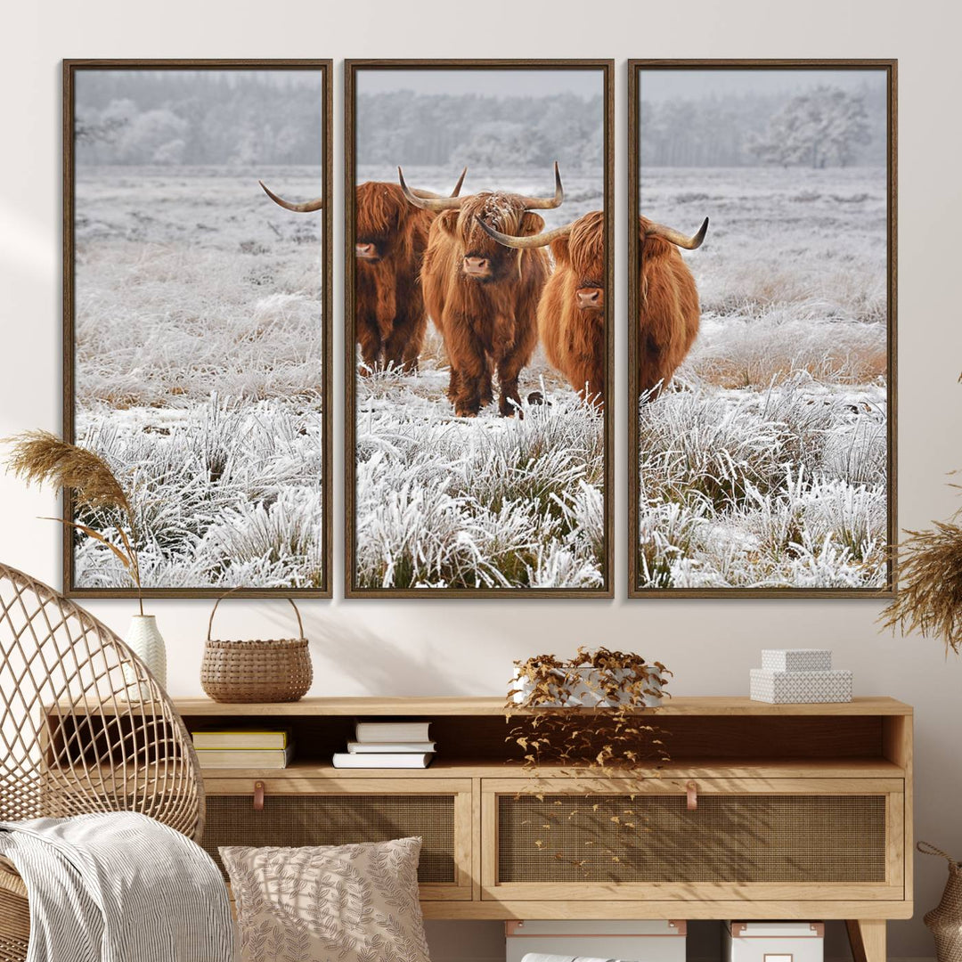 The Highland Cows in Snow canvas showcases three cattle in a frosty field.