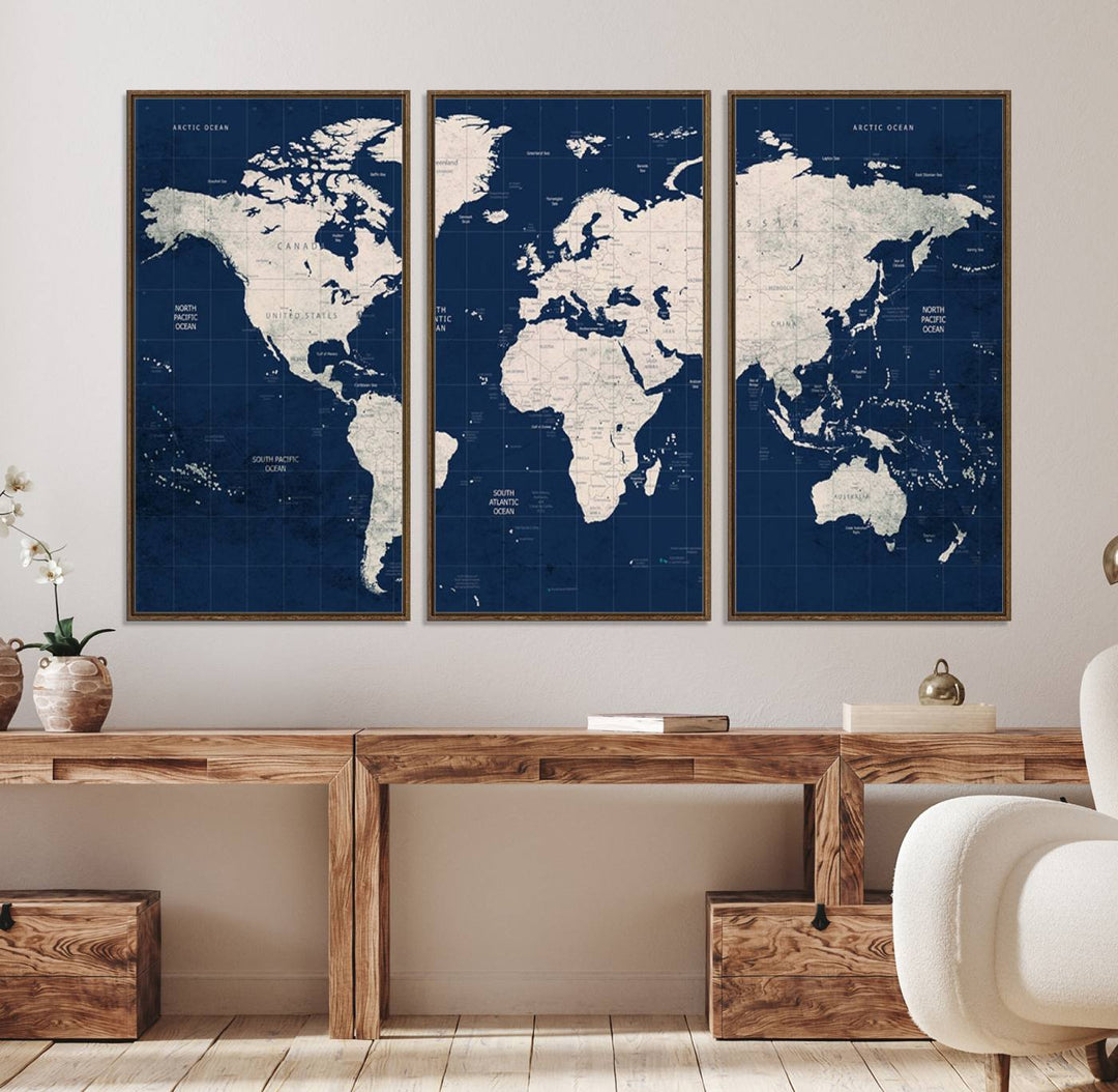 Large modern world map wall art canvas print in beige and navy; showcases a 3-panel vintage map design and is ready to hang.