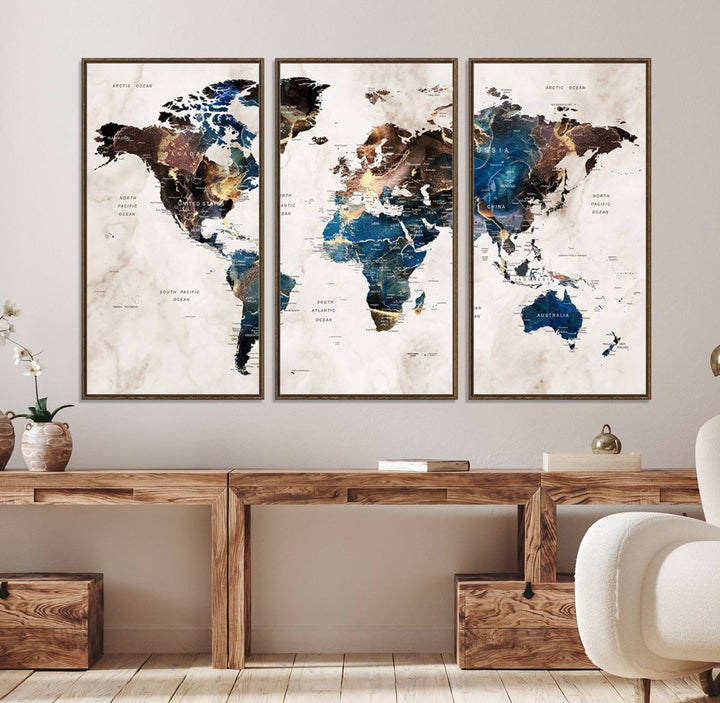 Abstract earth-toned 3-panel world map wall art featuring blues and browns, ready to hang; it showcases continents on modern canvas.