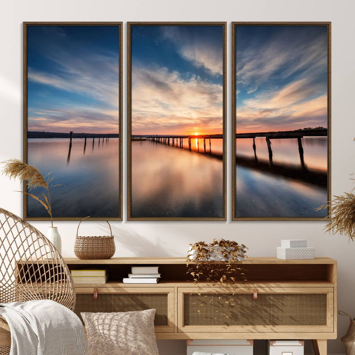 The Sunset Pier Canvas features a serene coastal landscape with vibrant hues under cloudy skies, ideal for modern decor.