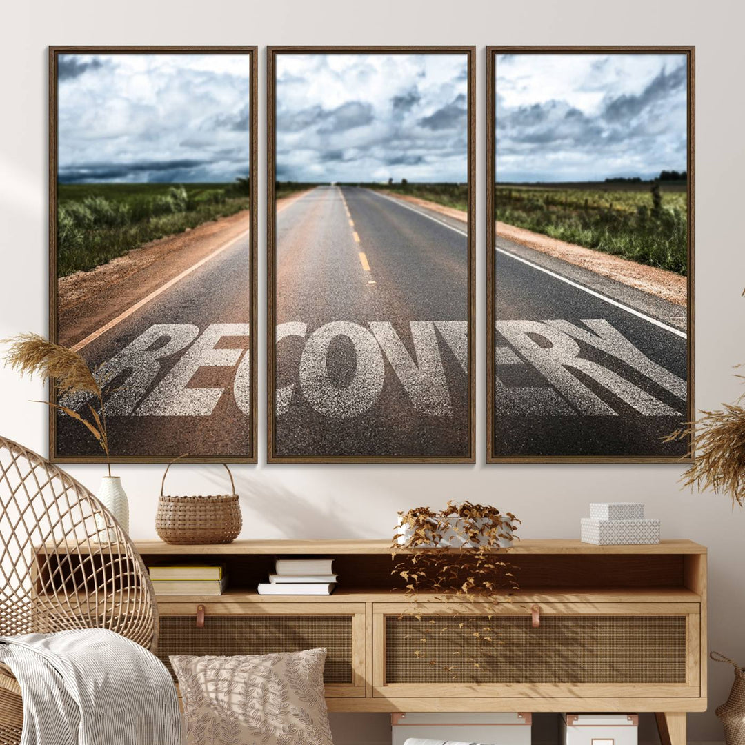 The Recovery Road Wall Art Canvas Print depicts a road under a cloudy horizon.