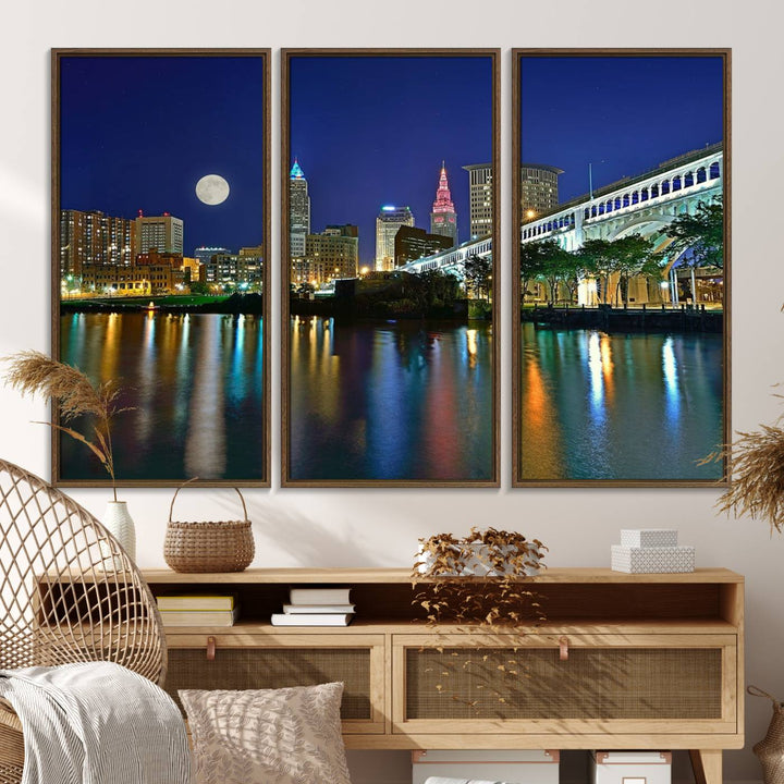 Cleveland City Lights Night Skyline Wall Art canvas showcases a moonlit cityscape reflected on water.