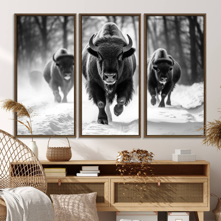 The Buffalo Wall Art Canvas Print of bison running through snow adorns the wall.