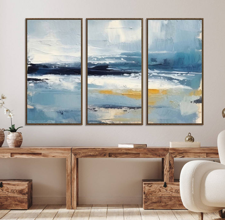 The Abstract Ocean Canvas Wall Art in coastal blue and gold enhances the modern kitchen.