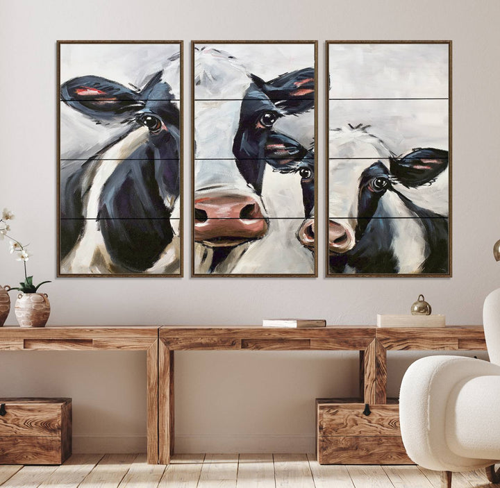 The Vintage Baby and Mom Cattle Canvas, featuring cows with black and white patches, is a prominent piece of wall art.