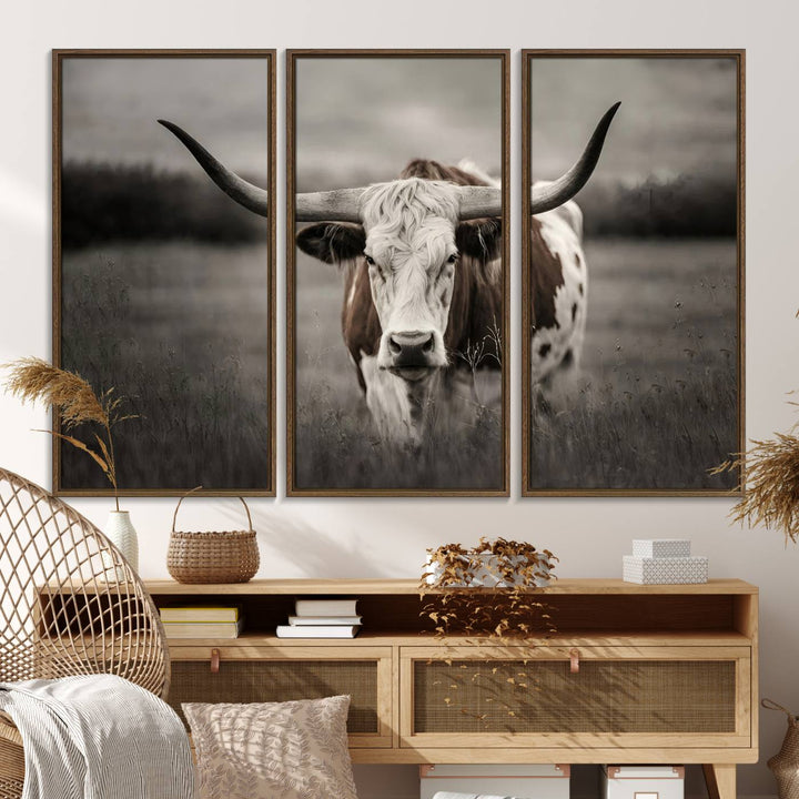 The Texas Longhorn Cow Canvas Wall Art Print adds a rustic touch to a living room.