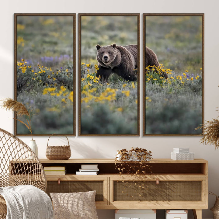 The "Queen of the Tetons" is a stunning canvas wall art print featuring Grizzly 399 walking through a field of yellow and purple flowers, showcasing the gallery-quality finish.