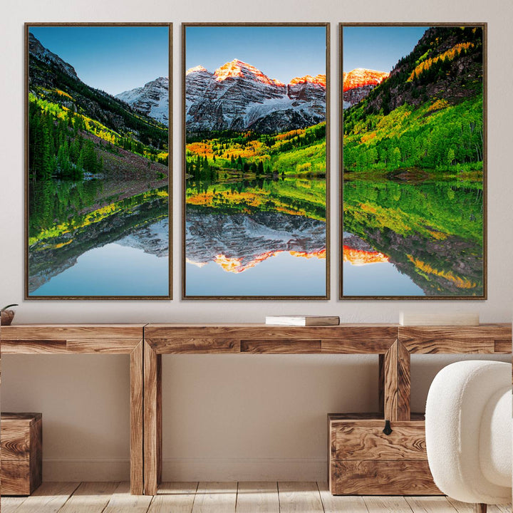 The Sunrise Maroon Bells Lake Wall Art Print beautifully captures North Maroon Peak mirrored in the tranquil lake, framed by lush greenery.