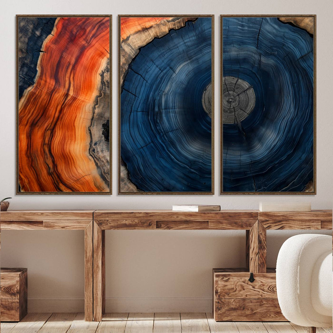 Abstract Tree Ring Wall Art Print on canvas featuring vibrant blue, orange, and brown rings with a natural rustic wood texture. Free shipping available!.